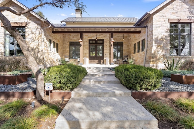 doorway to property featuring covered porch