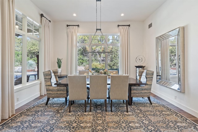 dining room with dark hardwood / wood-style flooring