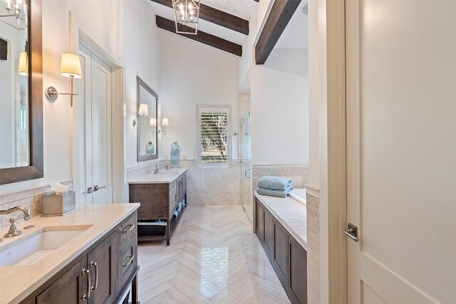 bathroom with lofted ceiling with beams, parquet floors, tile walls, vanity, and walk in shower