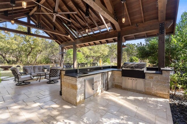 view of patio / terrace featuring ceiling fan, a gazebo, outdoor lounge area, area for grilling, and grilling area