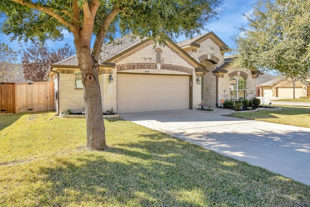 view of front facade with a garage and a front lawn