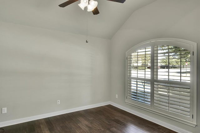 empty room with dark wood-type flooring, vaulted ceiling, and ceiling fan