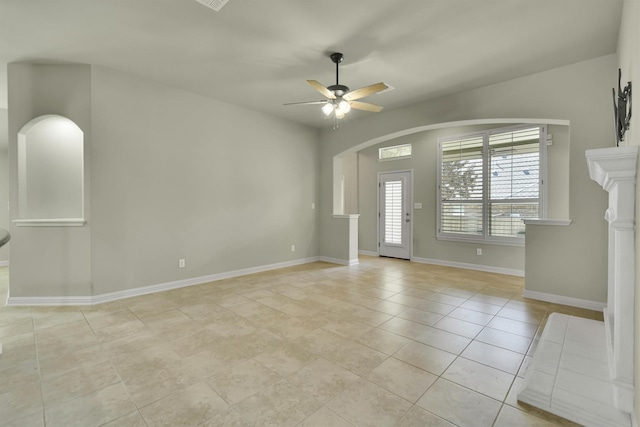 interior space featuring light tile patterned flooring and ceiling fan