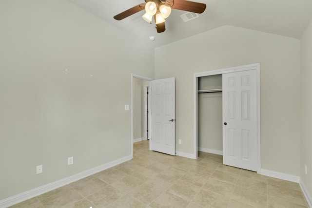 unfurnished bedroom with vaulted ceiling, ceiling fan, and a closet