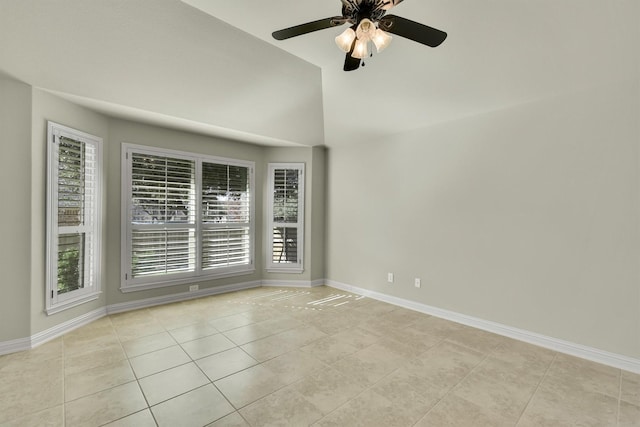 tiled spare room featuring ceiling fan