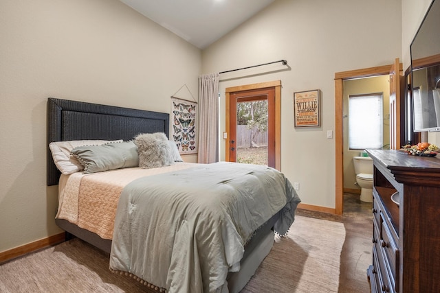 bedroom with vaulted ceiling and ensuite bathroom