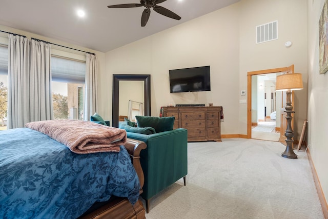 carpeted bedroom with vaulted ceiling and ceiling fan