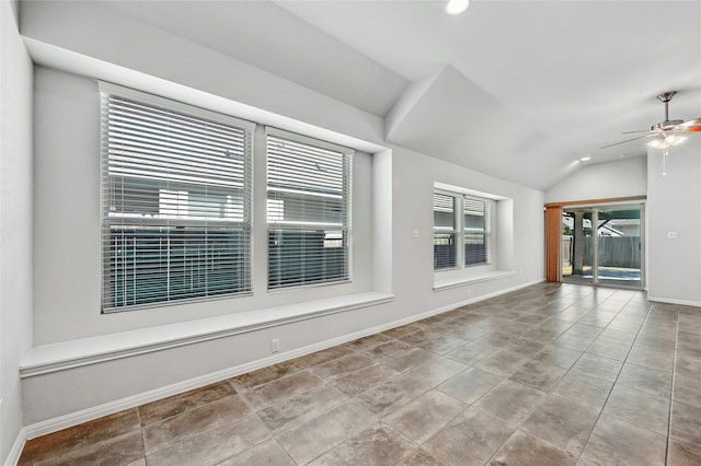 unfurnished room featuring lofted ceiling and ceiling fan