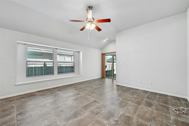 empty room with lofted ceiling and ceiling fan