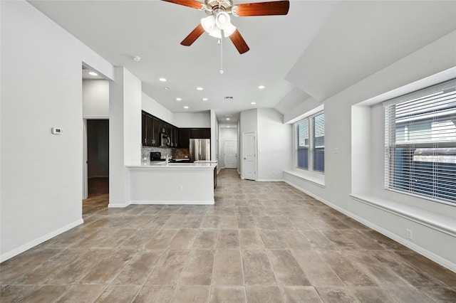 unfurnished living room with ceiling fan