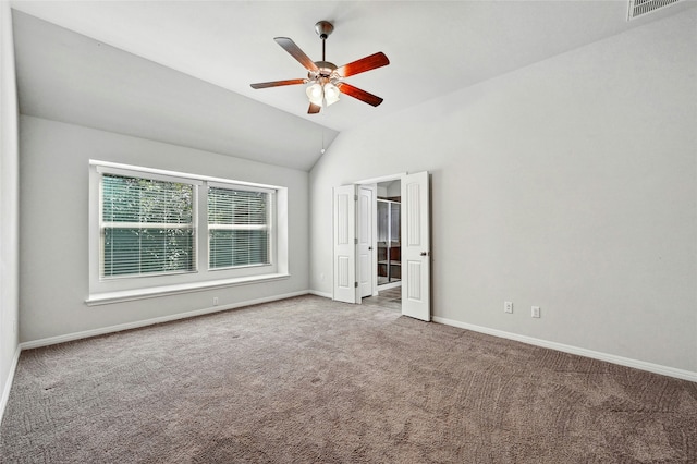 unfurnished bedroom featuring ceiling fan, lofted ceiling, and carpet floors