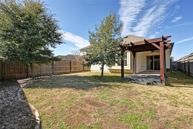 view of yard with ceiling fan and a patio area