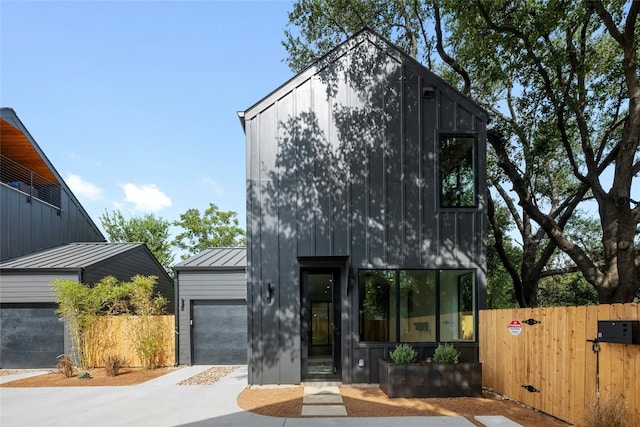 2010 Gathright Unit B, Austin, TX 78704 - contemporary house featuring a garage, a standing seam roof, concrete driveway, and a metal roof