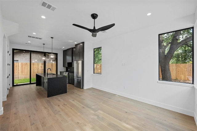 2010 Gathright Unit B, Austin, TX 78704 - kitchen with high end refrigerator, healthy amount of natural light, ceiling fan, and recessed lighting