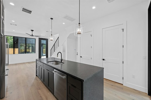 2010 Gathright Unit B, Austin, TX 78704 - kitchen with stainless steel dishwasher, dark countertops, recessed lighting, light wood finished floors, and ceiling fan