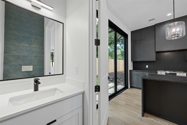 2010 Gathright Unit B, Austin, TX 78704 - bathroom featuring vanity, wood finished floors, and recessed lighting