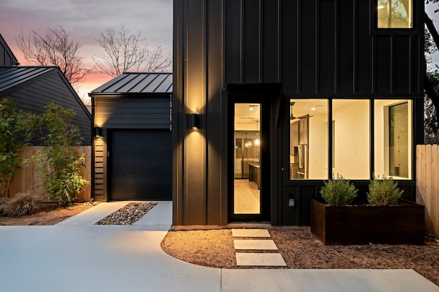 2010 Gathright Unit B, Austin, TX 78704 - contemporary house featuring a standing seam roof, concrete driveway, a metal roof, a garage, and board and batten siding