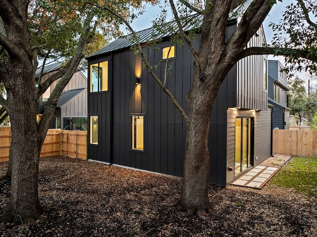 2010 Gathright Unit B, Austin, TX 78704 - view of property exterior with board and batten siding, a metal roof, and a standing seam roof