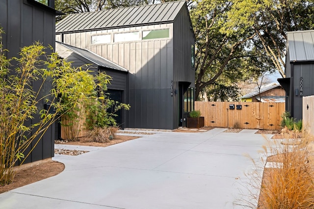 2010 Gathright Unit B, Austin, TX 78704 - view of property exterior featuring a standing seam roof, a metal roof, a gate, a patio area, and board and batten siding
