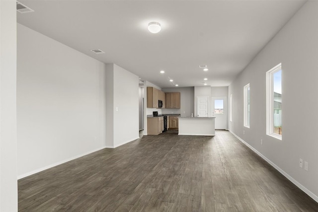 199 Lavender Ln, Elgin, TX 78621 - unfurnished living room with recessed lighting, visible vents, baseboards, and dark wood-style floors