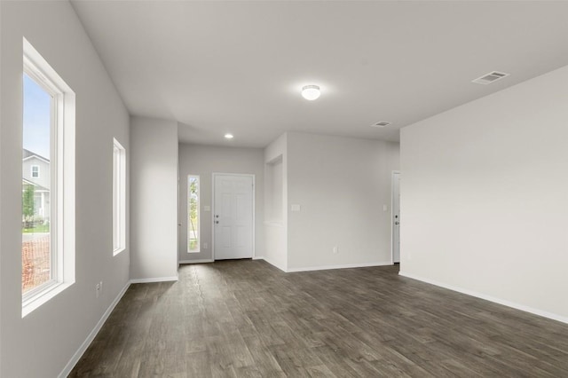 199 Lavender Ln, Elgin, TX 78621 - interior space featuring baseboards, visible vents, and dark wood-type flooring