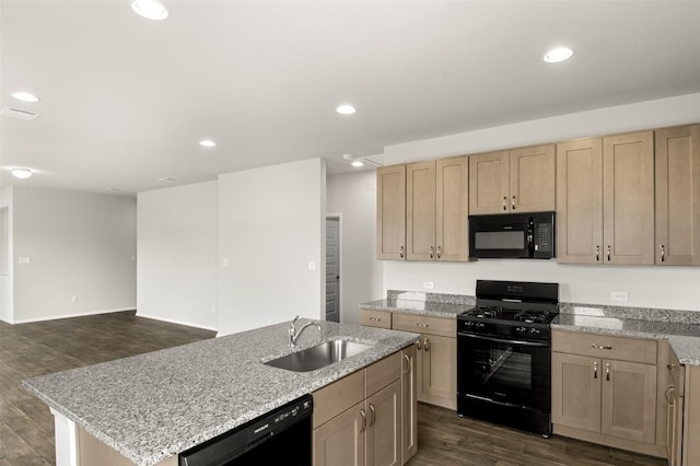 199 Lavender Ln, Elgin, TX 78621 - kitchen featuring dark wood-style flooring, black appliances, light brown cabinets, and a sink