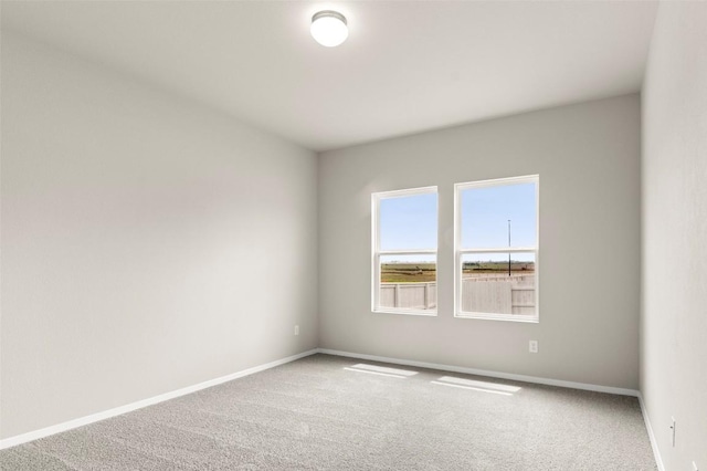 199 Lavender Ln, Elgin, TX 78621 - carpeted empty room with baseboards