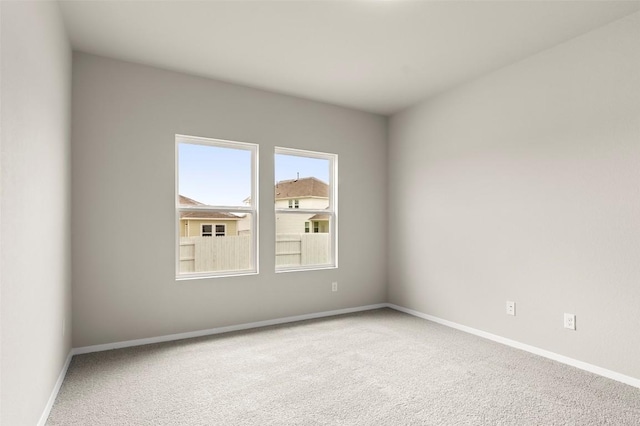 199 Lavender Ln, Elgin, TX 78621 - carpeted empty room with baseboards