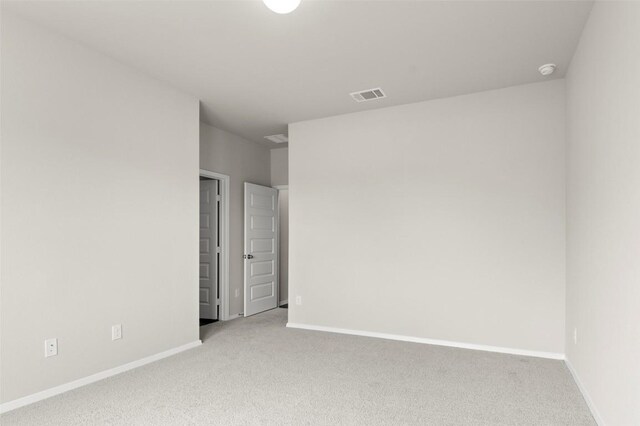 199 Lavender Ln, Elgin, TX 78621 - empty room featuring visible vents, baseboards, and light carpet