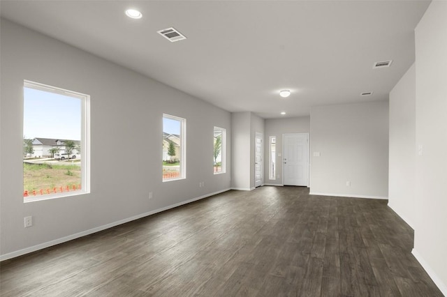 199 Lavender Ln, Elgin, TX 78621 - spare room featuring baseboards, recessed lighting, dark wood finished floors, and visible vents