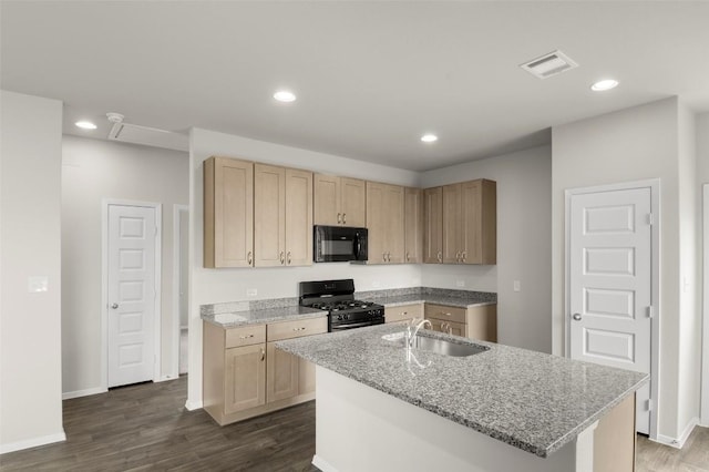 199 Lavender Ln, Elgin, TX 78621 - kitchen with light brown cabinetry, dark wood-style flooring, visible vents, a sink, and black appliances