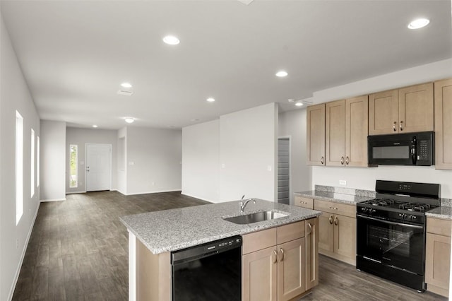 199 Lavender Ln, Elgin, TX 78621 - kitchen with an island with sink, light brown cabinetry, a sink, black appliances, and dark wood-style floors