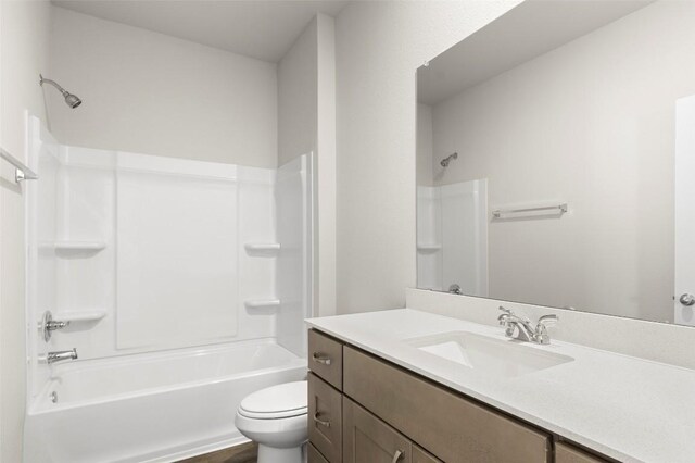 199 Lavender Ln, Elgin, TX 78621 - bathroom featuring toilet, shower / bathtub combination, and vanity