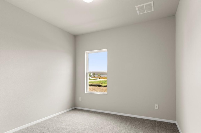199 Lavender Ln, Elgin, TX 78621 - spare room with carpet, visible vents, and baseboards