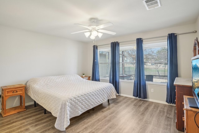 bedroom featuring ceiling fan and hardwood / wood-style floors