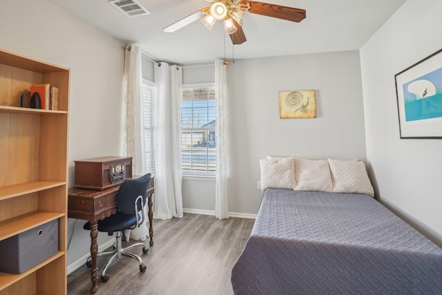 bedroom featuring light wood-type flooring and ceiling fan