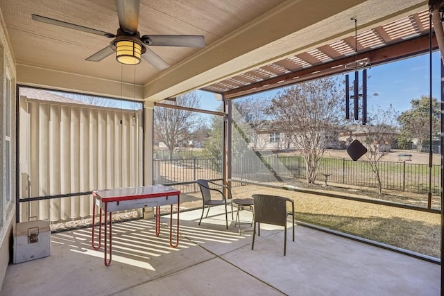 sunroom / solarium with ceiling fan