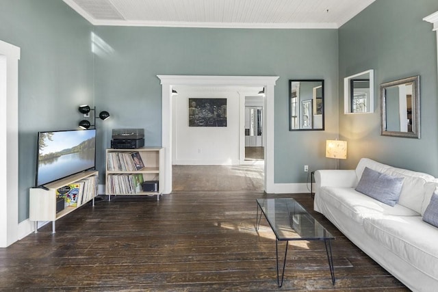 living room featuring dark wood-type flooring and ornamental molding