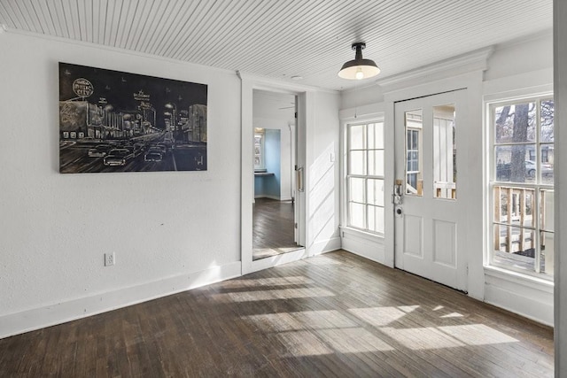 entrance foyer featuring wood-type flooring and crown molding