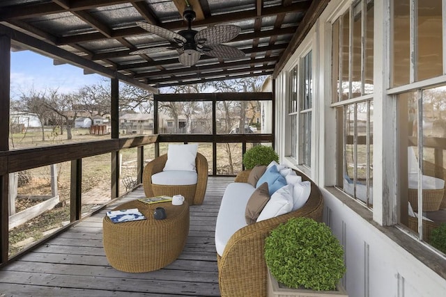 sunroom / solarium with ceiling fan