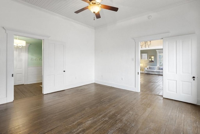 spare room with crown molding, ceiling fan, and dark hardwood / wood-style floors