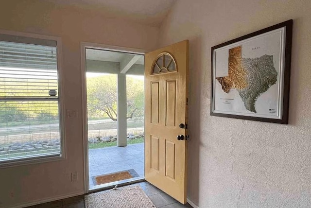 entryway featuring light tile patterned flooring