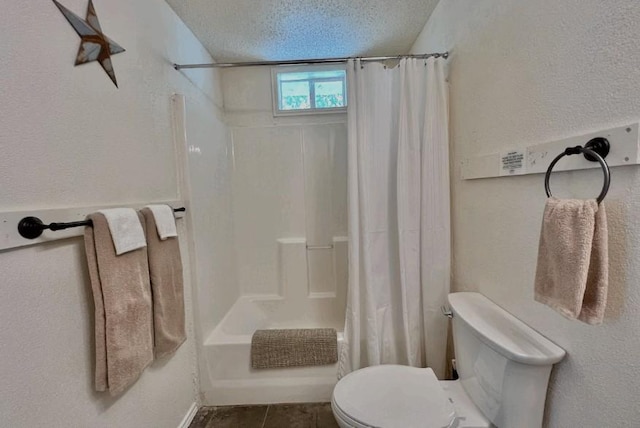 bathroom featuring shower / tub combo with curtain, tile patterned flooring, toilet, and a textured ceiling