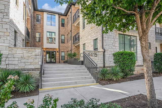 view of property featuring stairway