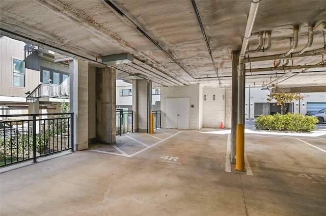 parking deck featuring concrete block wall