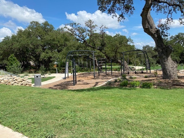 community play area with a lawn