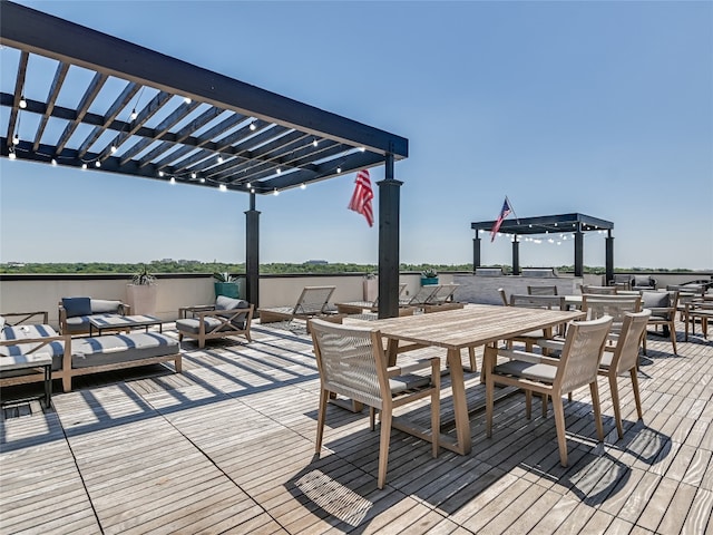 deck featuring an outdoor hangout area, outdoor dining space, and a pergola