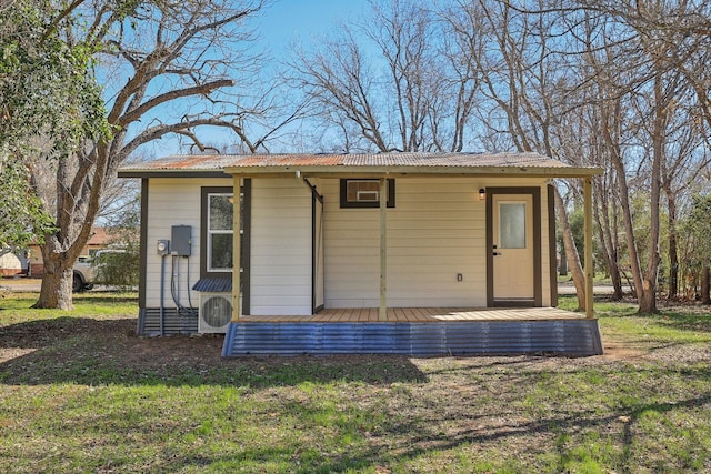 view of outbuilding with a lawn