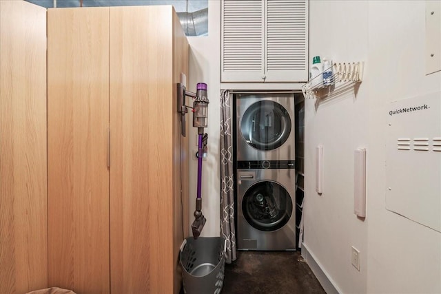 washroom with stacked washer and clothes dryer