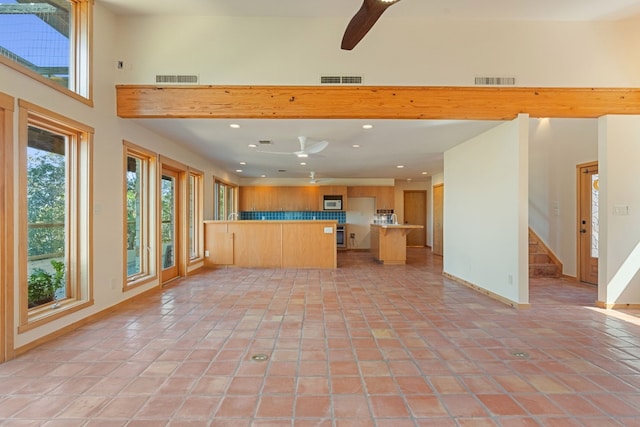 212 Comanche Cp, Kyle, TX 78640 - unfurnished living room with recessed lighting, stairs, a ceiling fan, light tile patterned floors, and baseboards